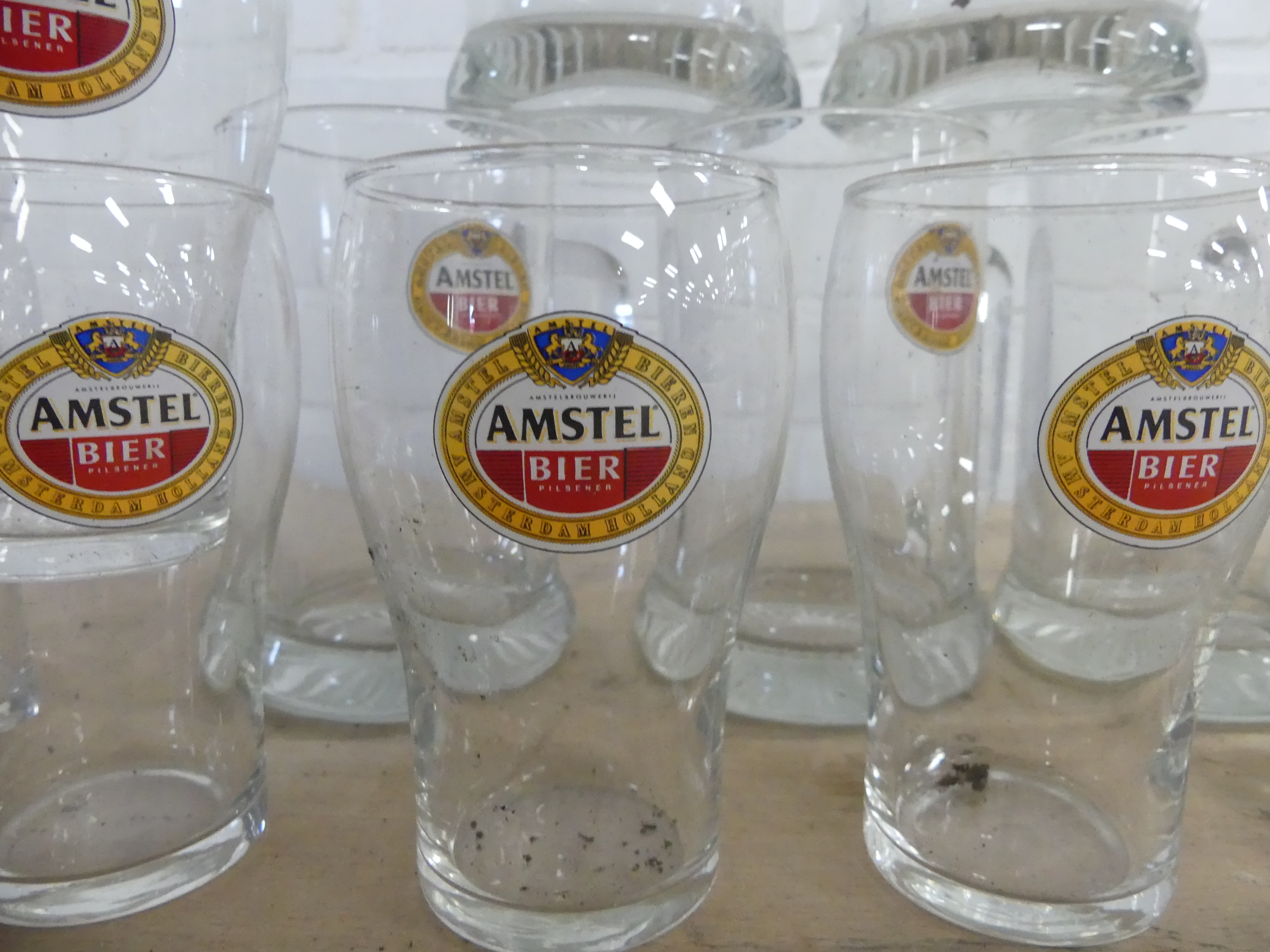 12 Amstel bierglazen waarvan 6 pullen 1/2 liter